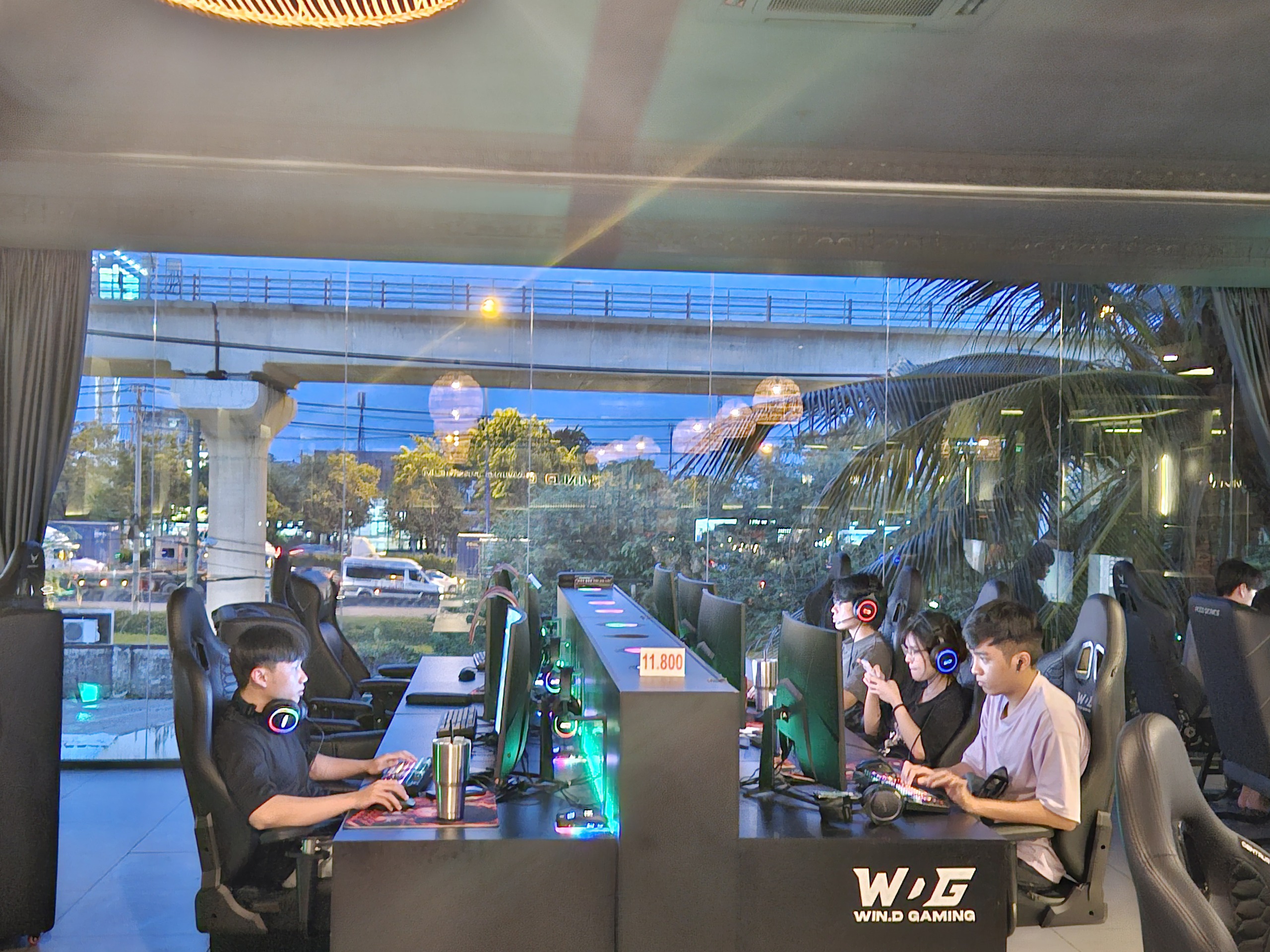 Net room view overlooking Hanoi Highway and Metro train